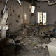 At the time of the airstrike, the operating theatres were in use – there were patients on the tables being attended to by surgeons and anesthetists. In this operating theatre, you can see the hole in the back wall from a bomb and the shrapnel damage. The bed is barely recognizable near the window.